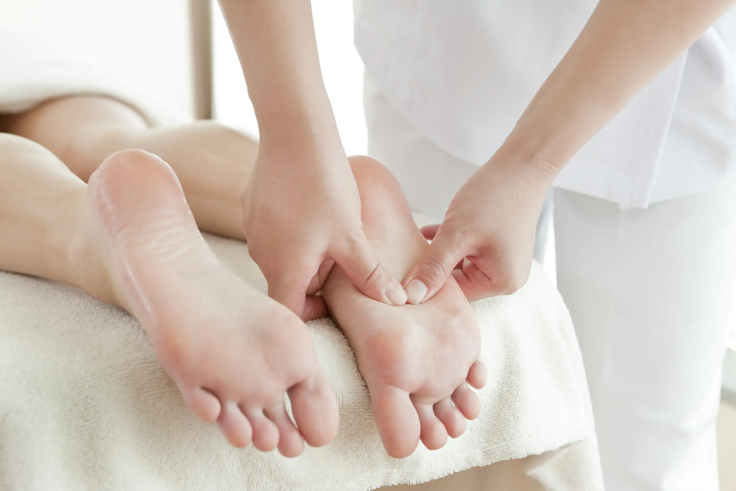 A person is getting their foot massage