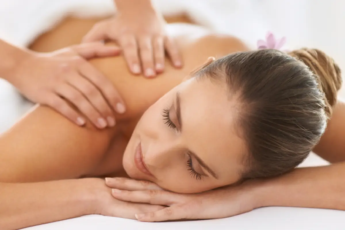 A woman getting her back touched by someone else