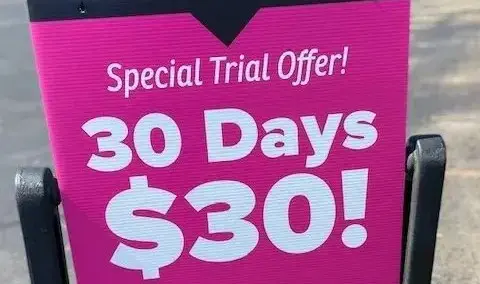 A sign that says special trial offer 3 0 days for $ 3 0.